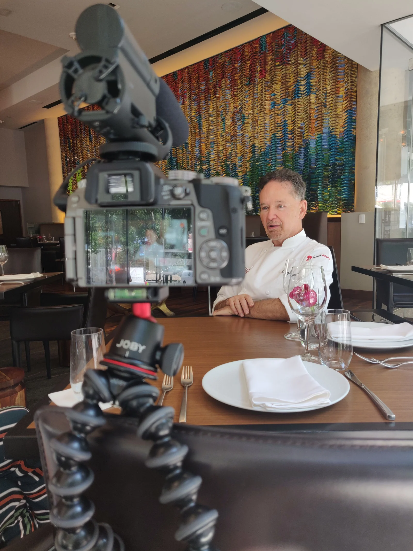 Filming Leslie Brenner interviewing Stephan Pyles for The Food Talk