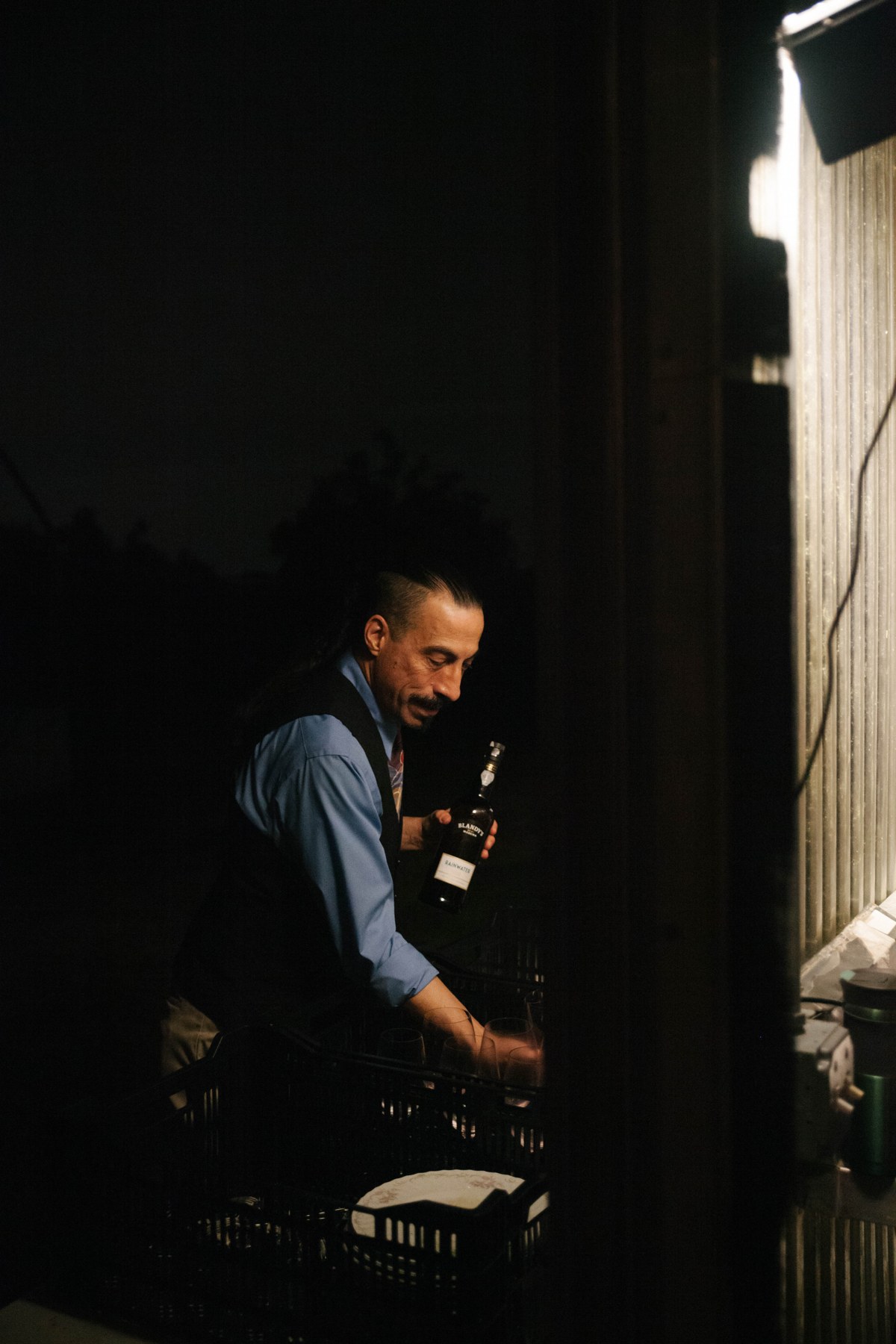 At the greenhouse door after dark.