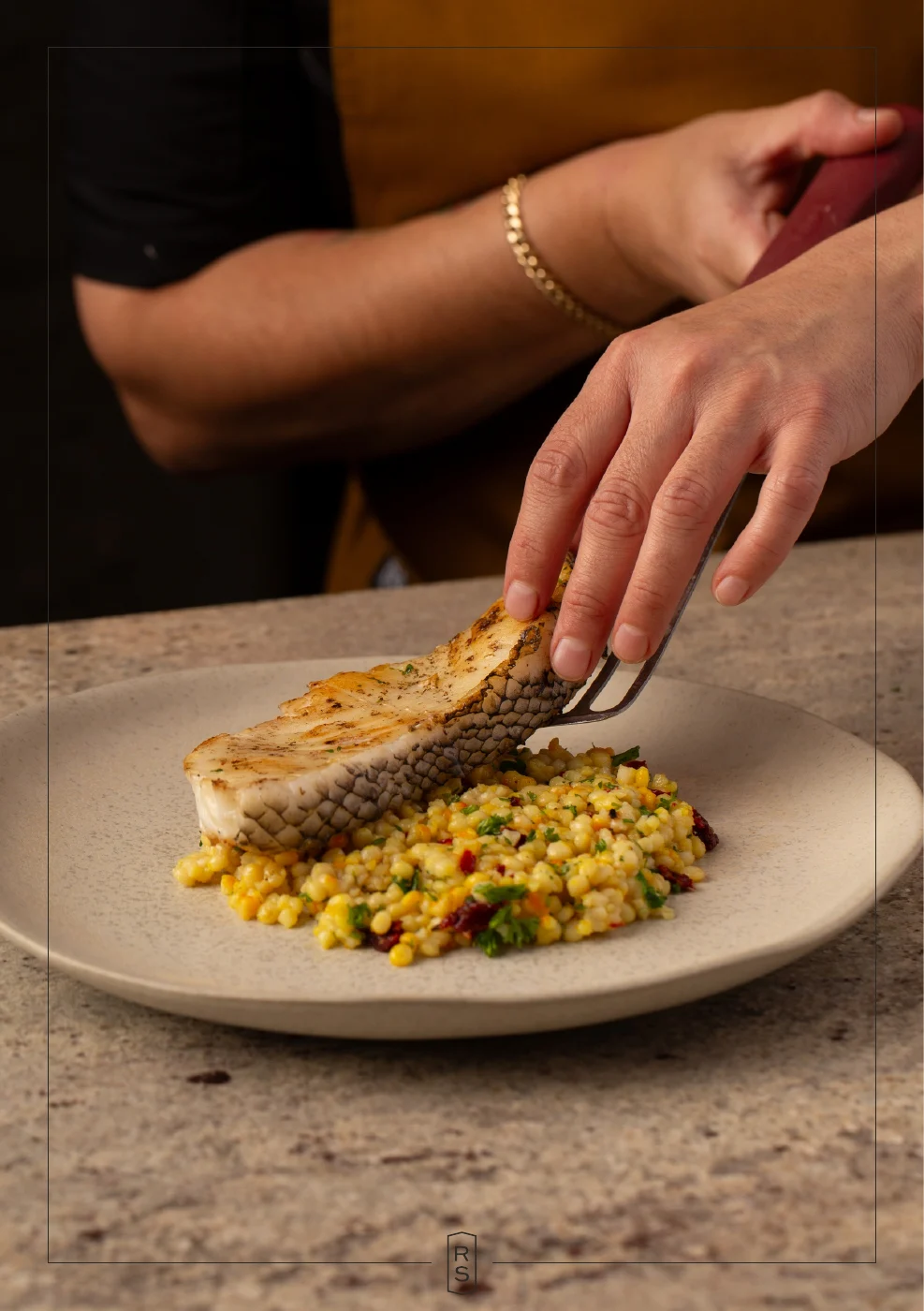 Booklet page 4: Rosie arranging fish on a bed of grains