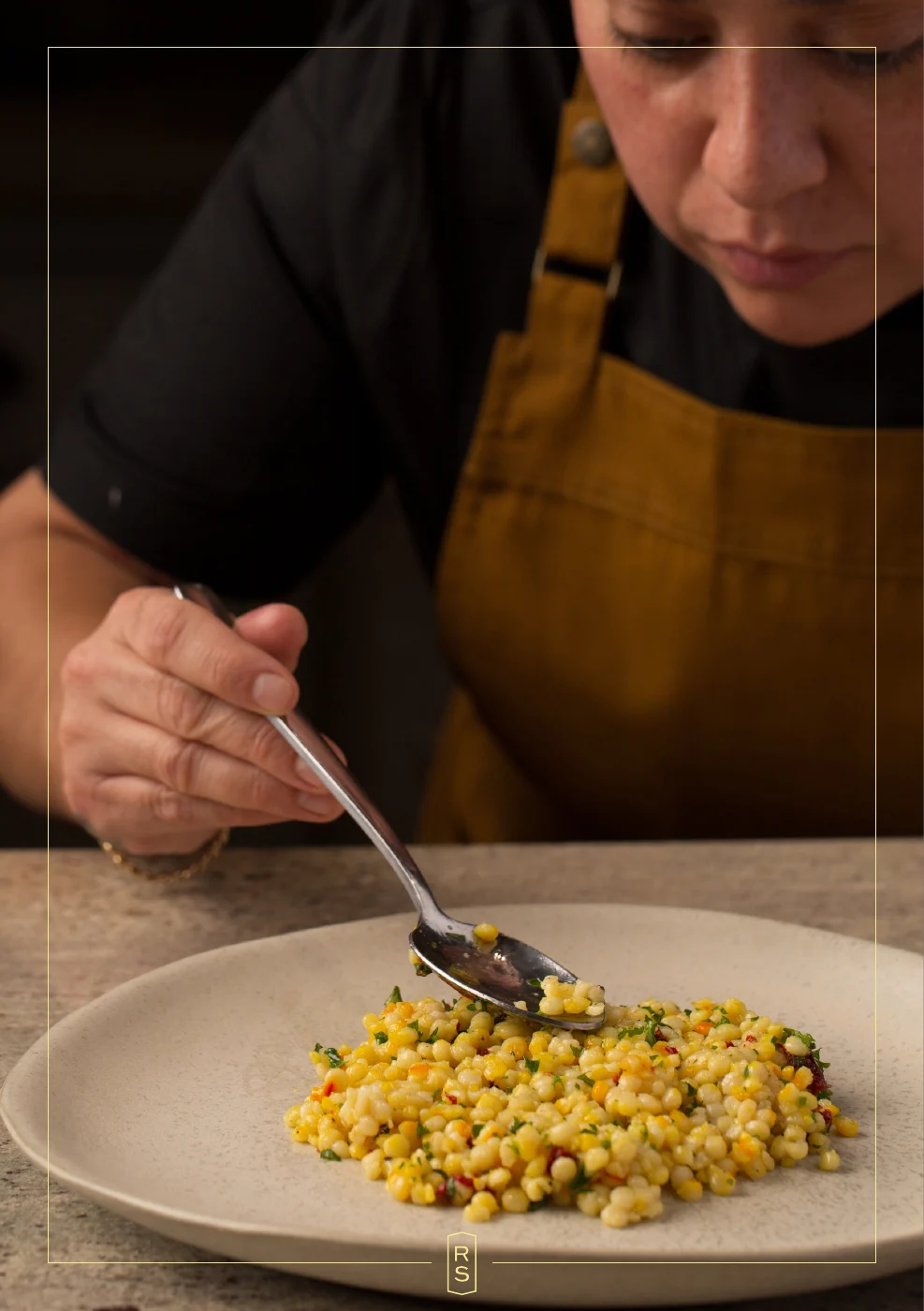 Booklet page 2: Rosie spooning sauce over a plated fish dish